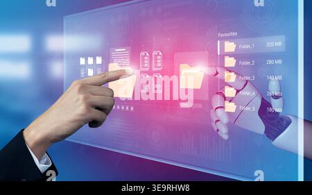 A hand interacts with a glowing virtual display showcasing digital folders and files, symbolizing modern data management and innovative technology Stock Photo