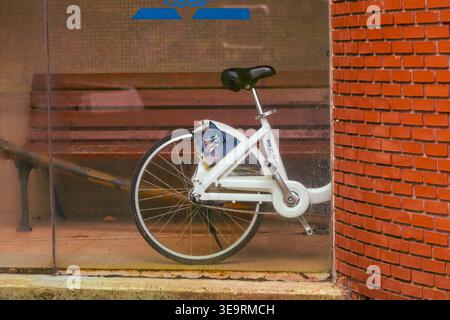 Tea New White Bicycle Behind Glass Wall Stock Photo
