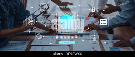 Professionals engaged in a collaborative discussion on cyber security strategies, utilizing technology and data for effective business planning in a Stock Photo