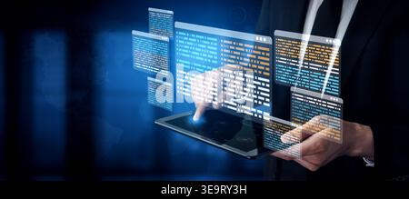 A businessman interacts with a tablet displaying digital data interfaces, showcasing technology and innovation in a contemporary business environment Stock Photo