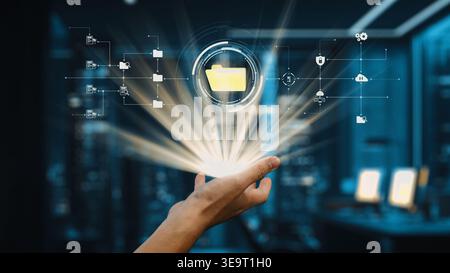 A hand reaches out towards a glowing digital folder, symbolizing modern data management and technology innovation in a futuristic office environment Stock Photo