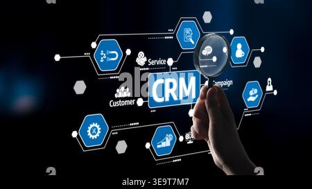 A detailed visualization of CRM software features with a magnifying glass highlighting customer service and campaign management icons in a digital Stock Photo
