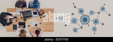 A diverse team engages in a collaborative session with laptops and digital tools. The workspace highlights technology role in fostering creativity and Stock Photo