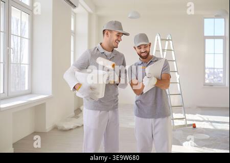 Professional Painters Working On Home Renovation Stock Photo
