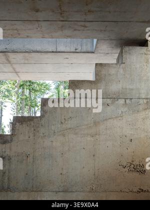 Raw concrete staircase structure with geometric lines and natural light, showcasing brutalist architecture, minimalist design and industrial texture, Stock Photo