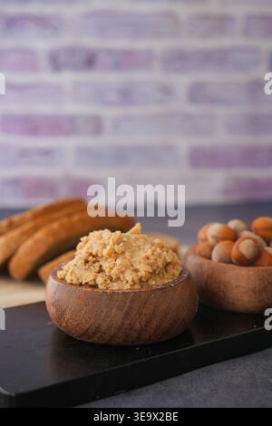 hazelnut spread and nuts on a table  Stock Photo