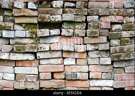 Neatly stacked orange and white vintage bricks can be used as background or texture Stock Photo