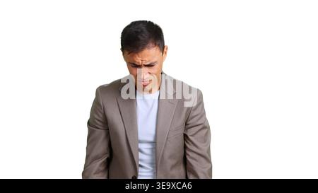 Businessman looking down experiencing regret and disappointment Stock Photo
