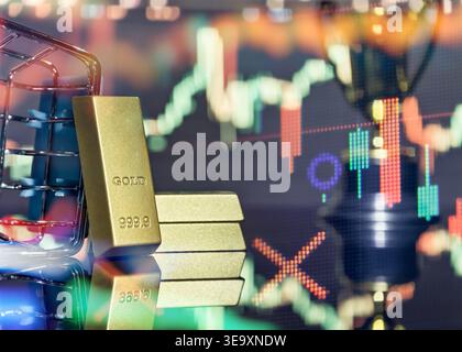 Buying physical gold. Gold bars, shopping trolley, and stock market quotes with double exposure effect. Concept of retail investing and inflation prot Stock Photo