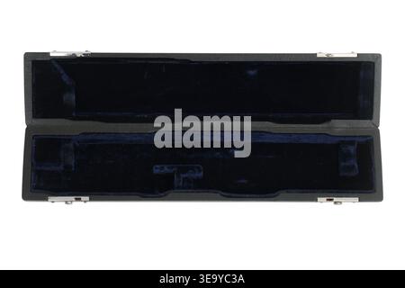 Empty black case for musical instrument flute. Hard velvet lined container for storage and transport of flute. Professional woodwind equipment accesso Stock Photo