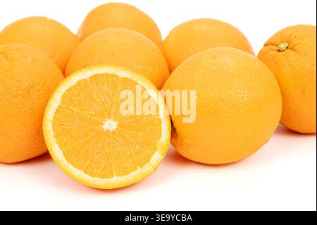 Group of fresh ripe oranges with a half slice isolated on white background. Stock Photo