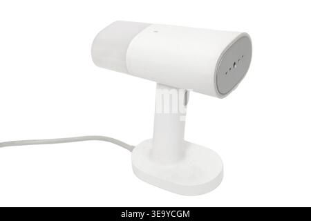 Handheld garment steamer on white background. Portable clothes iron for domestic laundry care. Modern steam cleaner device for smooth fabric and wrink Stock Photo