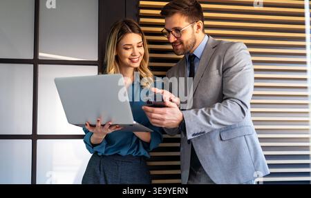 Team of programmers writing digital code in the metaverse and working together on the internet Stock Photo