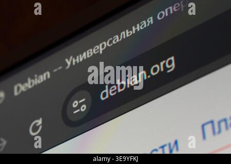 18 April 2026 - Tashkent, Uzbekistan: Close up view of Debian website on digital screen showing domain name and browser interface elements. Stock Photo
