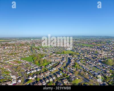 Aerial view of a residential area in a small town surrounded by lush ...
