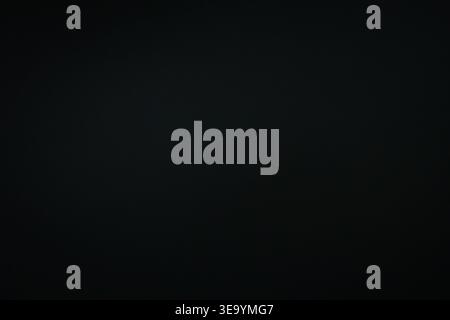 Minimal dark gradient background with a soft vignette and gentle center glow. Clean negative space offers an unobtrusive canvas for text product Stock Photo