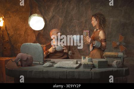 Prehistoric office workers having a coffee break together in the cave, they are relaxing and talking Stock Photo