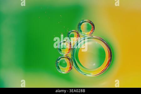 Oil drops in water creating abstract bubbles with vibrant green and yellow gradient background, highlighting separation and fluidity. Photography, no Stock Photo