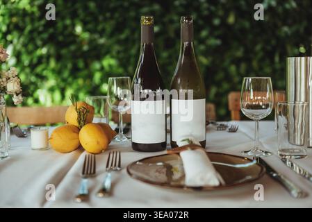 Set table with two bottles of white-labeled wine for a wedding Stock Photo