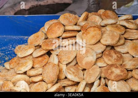 Pile of freshly baked traditional Ladakh bread with sesame seeds at bakery street market in Leh, Himalayas India, authentic local street food  Stock Photo