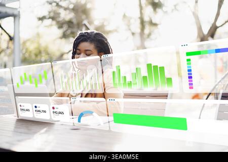 Working on a digital business chart with AI tools in a modern office setting Stock Photo