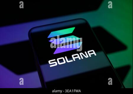 PARIS, FRANCE - APRIL 20, 2026: The Solana (SOL) cryptocurrency logo shown on a mobile device, representing blockchain technology and digital finance. Stock Photo