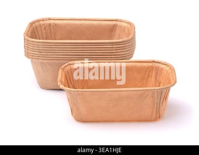 Stack of empty disposable rectangular brown paper baking molds isolated on white Stock Photo