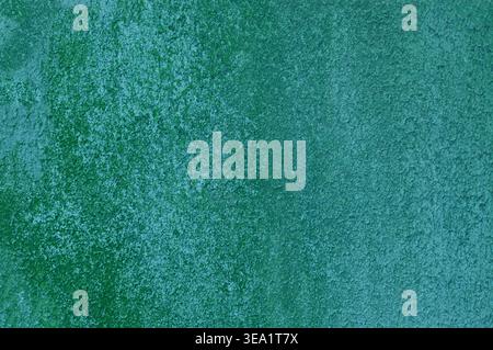 Faint grain patterns swirl across green canvas. Soft gradient transitions from deep to bright tones. Ideal backdrop for design, art, or branding proje Stock Photo