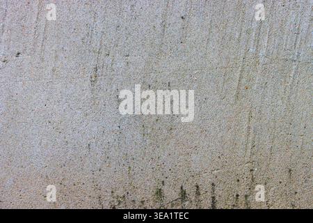 Vertical streaks and faint discolorations tell of time. Grainy surface hints at rustic, industrial origins. Ideal backdrop for designs needing raw Stock Photo