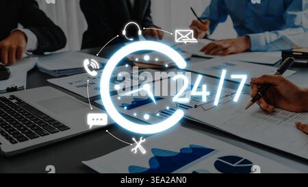 A dynamic office scene showcasing teamwork and strategy development, emphasizing continuous support and data analysis for business growth and success Stock Photo