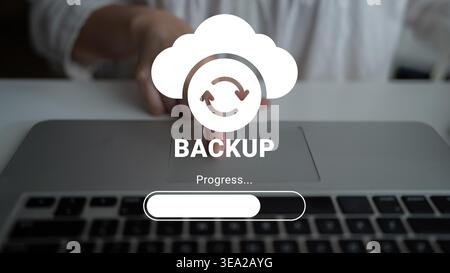 Conceptual image depicting the cloud backup process with a progress bar on a laptop, emphasizing user interaction and the importance of data security Stock Photo