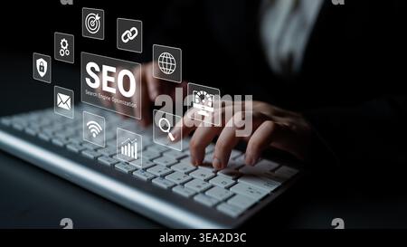 A dynamic scene showcasing a person typing on a keyboard with various SEO icons overlaying the image, highlighting the significance of search engine Stock Photo