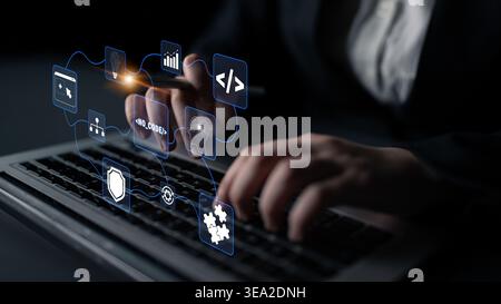 Business Professional Using Laptop with Digital Icons Representing Technology, Data Analysis, and Software Development in Dark Environment Quark. Stock Photo