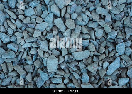 Granite gravel chips materials for the construction. Natural crushed granite gravel as a background. Industrial design. Granite gravel texture Stock Photo
