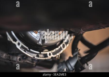A close-up shot of an automobile's clutch, with the flywheel and related components, showcasing intricate details of the mechanical parts. Stock Photo