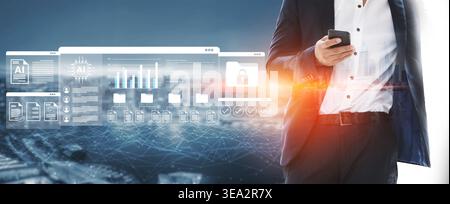 A business professional interacts with a smartphone while surrounded by a futuristic digital interface showcasing data visualization and insights in a Stock Photo