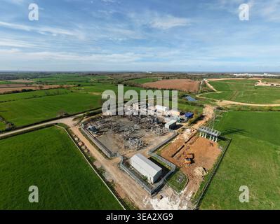 Aerial view of Coalville Substation with electrical infrastructure and construction work surrounded by green fields in Coalville, England, United King Stock Photo