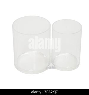 Empty clear plastic double makeup brush holder on white background. Transparent desk organizer for pens and cosmetic tools. Minimalist bathroom access Stock Photo