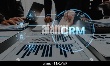 Business team working on a digital marketing strategy using CRM tools and data visualization, focusing on collaboration and performance analysis in a Stock Photo