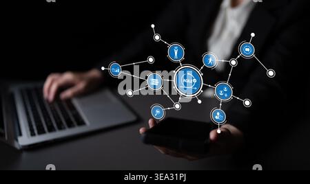 A business professional interacts with a smartphone displaying an agile methodology concept, representing digital connectivity and modern workplace Stock Photo