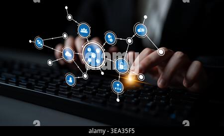 A conceptual image showcasing digital connectivity with technology icons superimposed over a keyboard, representing data management, security, and Stock Photo