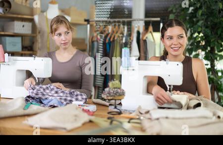 Two female tailors working in the workshop Stock Photo