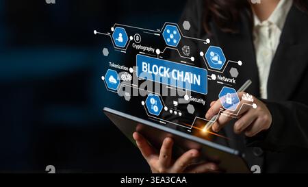 A business professional engages with a digital tablet, exploring blockchain technology through interactive graphics focused on security and network Stock Photo