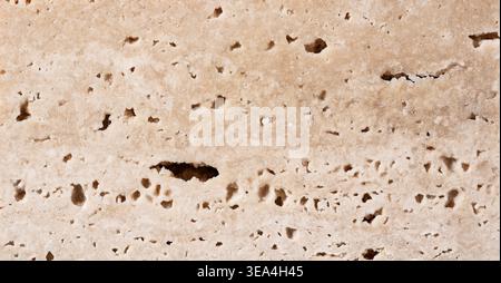 High resolution beige travertine stone texture background, porous natural limestone surface Stock Photo