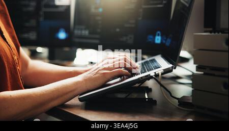 Laptop, typing and programmer with hands of person in office for web developer, coder or research. Software engineer, firewall update and coding Stock Photo