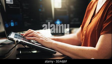 Laptop, typing and developer with hands of person in office for web programmer, coder or research. Software engineer, firewall update and coding Stock Photo