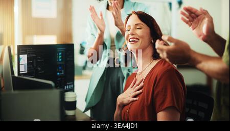 Computer, programmer and applause with business woman in office for app developer, support and database. It engineer, software launch success and Stock Photo