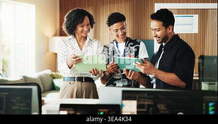 Tablet, coding and research with business people in office for programmer review, team and project. Web developer, software engineer and tech workshop Stock Photo