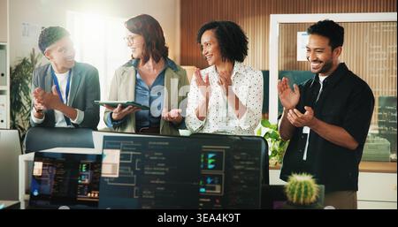 Applause, programmer and tablet with business people in office for app developer, support and database. It engineer, software launch success and Stock Photo