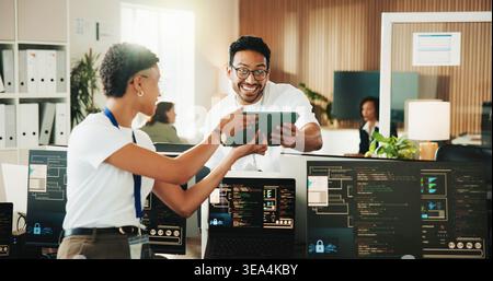 Tablet, programmer and excited with business people in office for app developer, support and database. It engineer, software launch success and Stock Photo